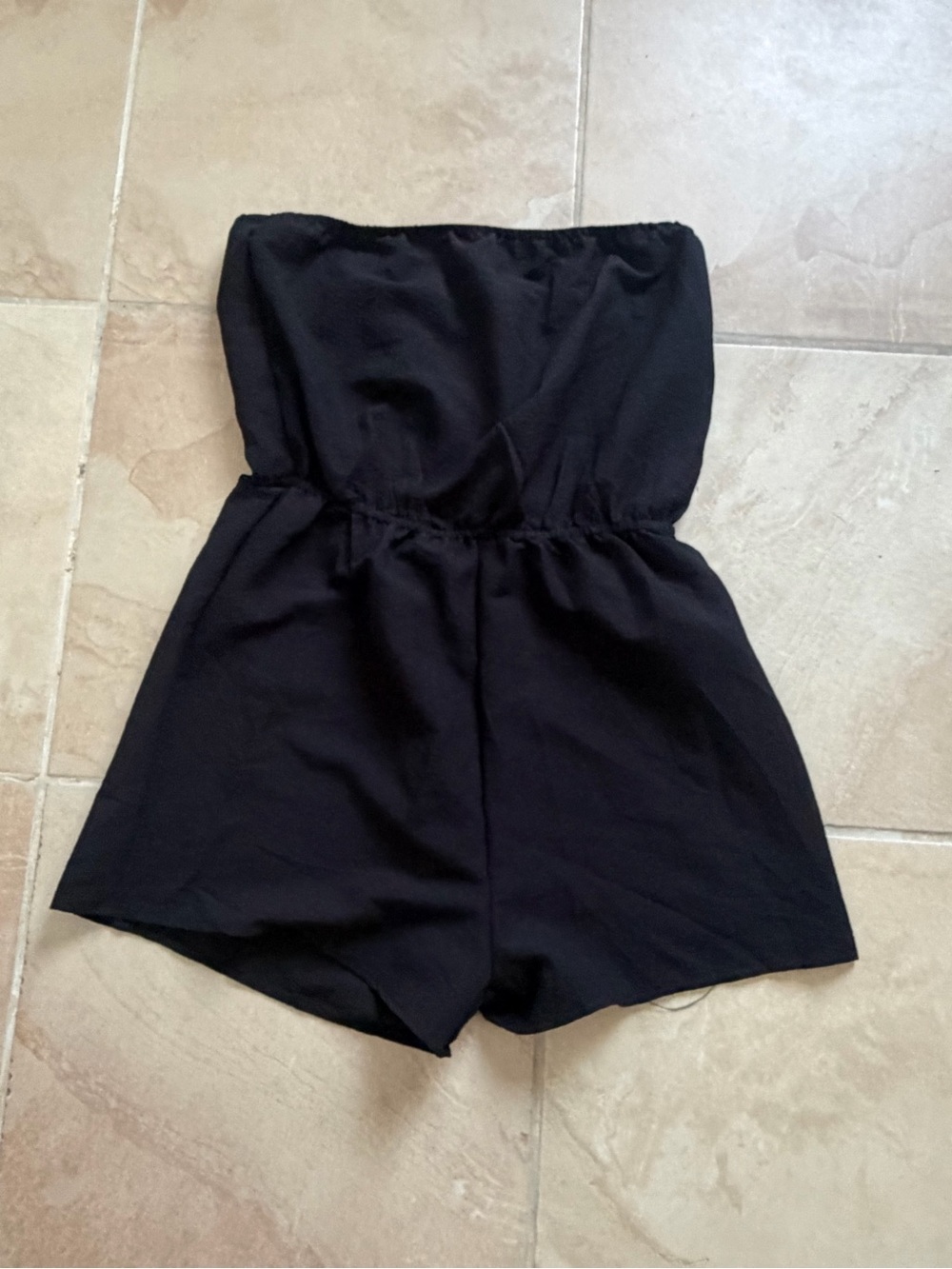 Black Strapless womenโs One-Piece Romper never worn brand new